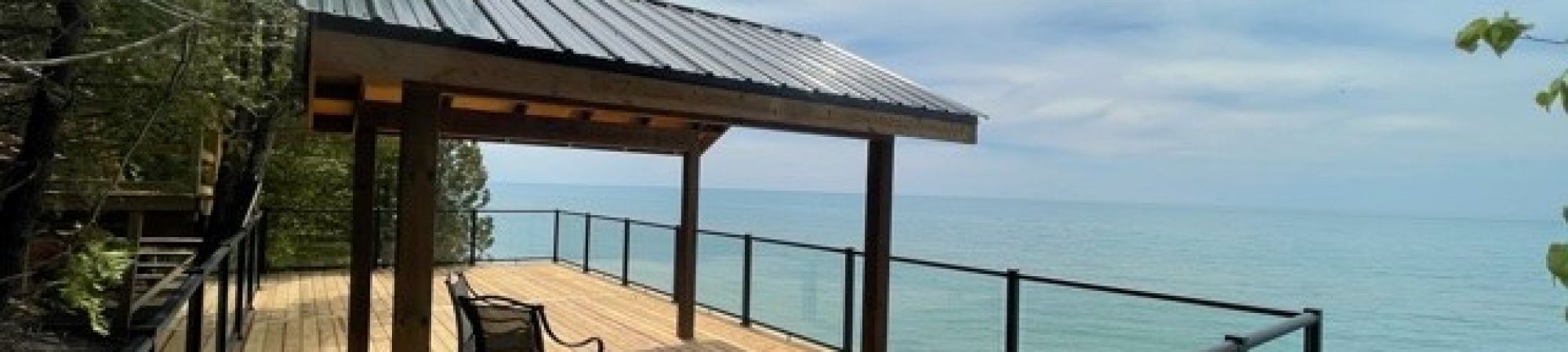 Glass Railings with black aluminum frames and posts